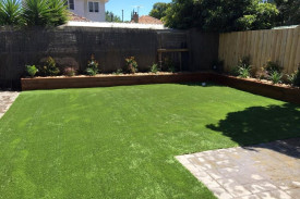 synthetic turf, garden around perimeter, pavers